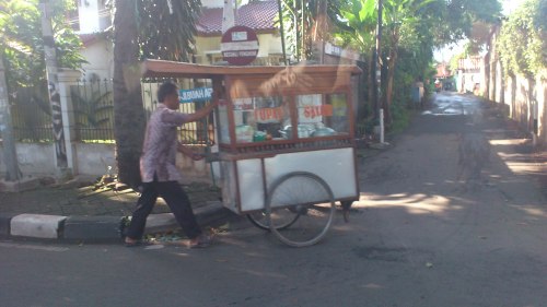 man selling breakfast jakarta street